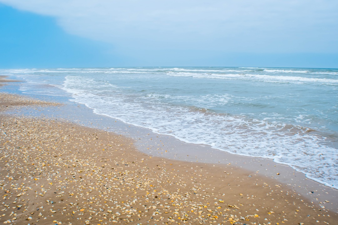 A beautiful soft and fine sandy beach along the gulf coast of South Padre Island, Texas