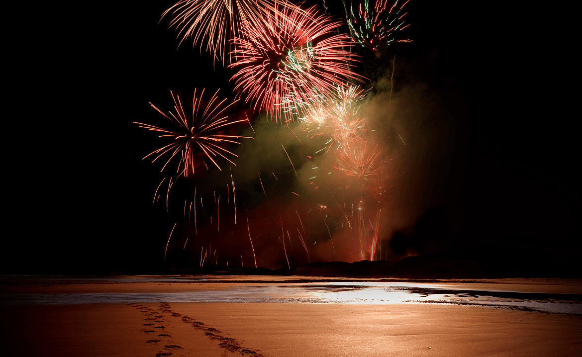 Fireworks in the night at the beach 